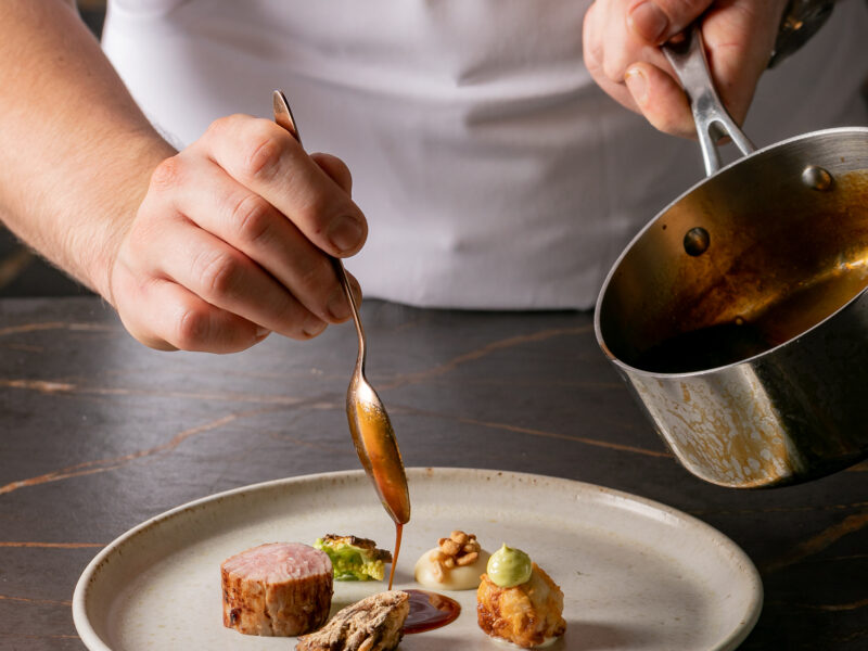 Chef serving fine dining food