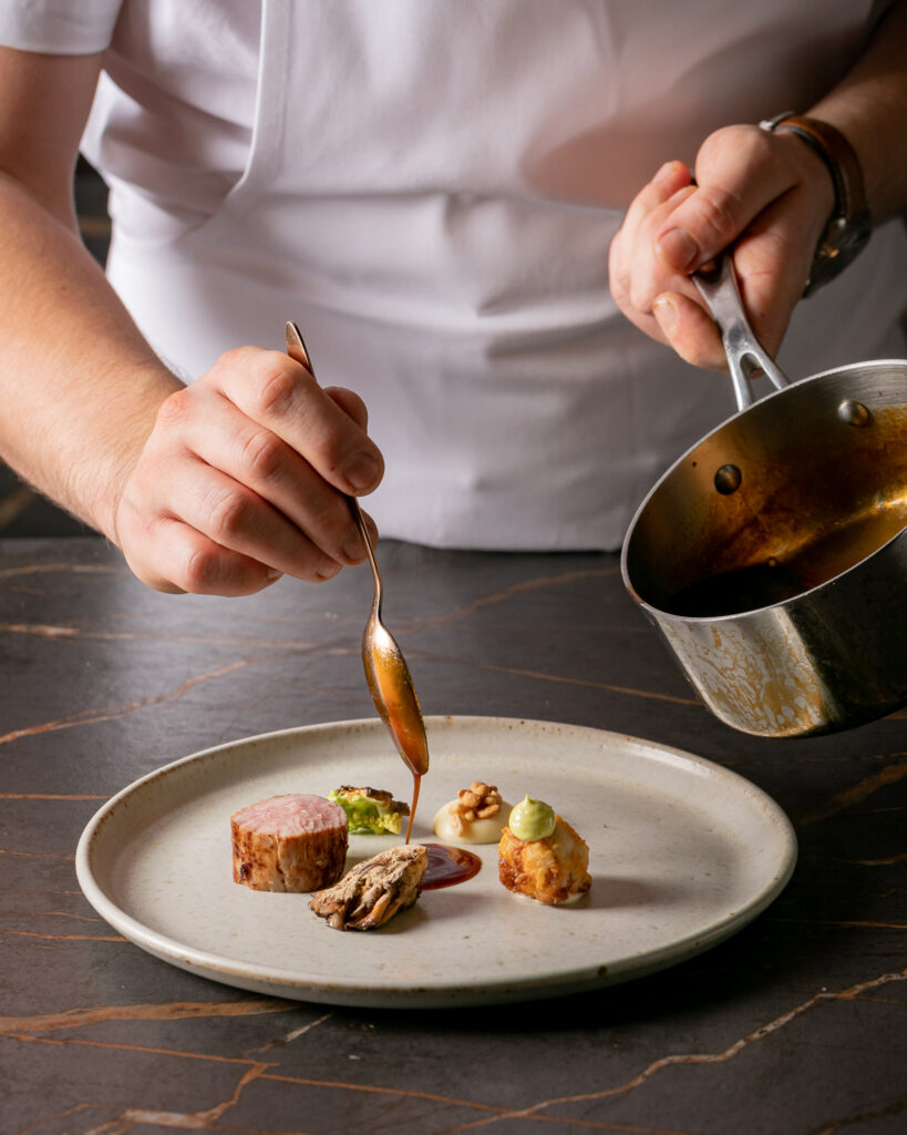 Chef serving fine dining food